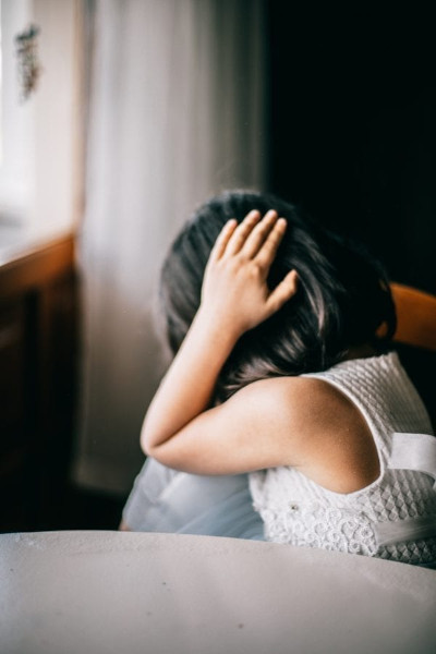 Girl with hands in hair